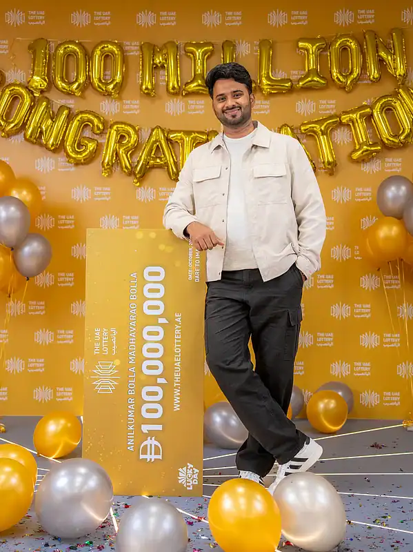 Telangana IT professional Anilkumar Bolla poses with his winning cheque after bagging Dirham 100 million in The UAE Lottery.