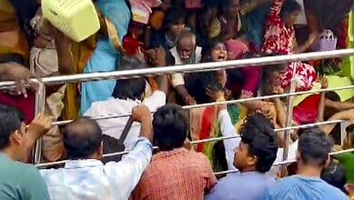 People gather at Venkateswara temple, at Kasibugga in Srikakulam district, Andhra Pradesh, Saturday. Atleast nine people were killed and two others suffered injuries after a stampede. (PTI Photo)