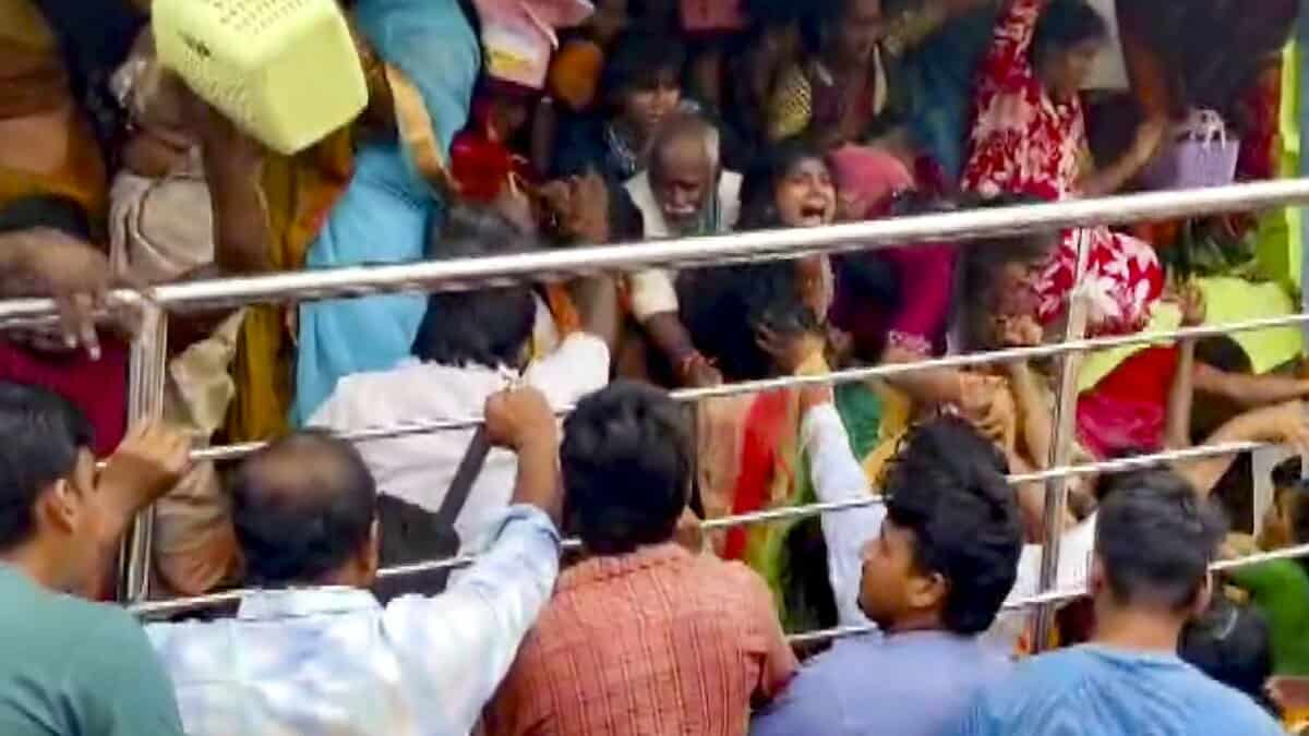 People gather at Venkateswara temple, at Kasibugga in Srikakulam district, Andhra Pradesh, Saturday. Atleast nine people were killed and two others suffered injuries after a stampede. (PTI Photo)