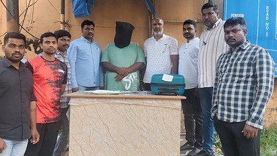 Ejaz Ahmed (face covered) was arrested by Hyderabad police for drug peddling