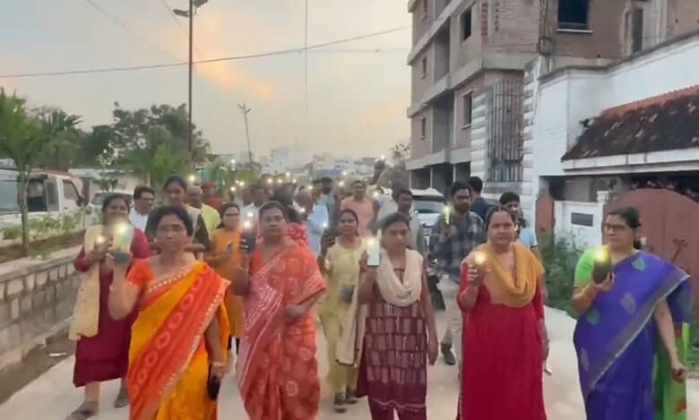 Women participate in a rally for HYDRAA in Manikonda