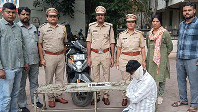 Telangana excise police along with the accused ( face covered) and Hash oil