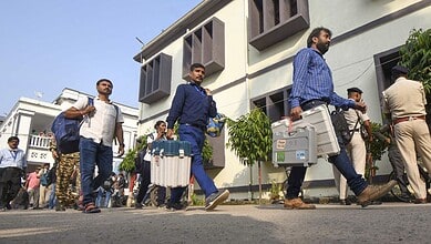 Polling officials with EVM and other election material leave for their respective booths on the eve of the first phase of the Bihar Assembly elections, in Patna on Wednesday (PTI)