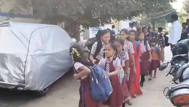 students walk in line after the government school was locked over non-payment of rent