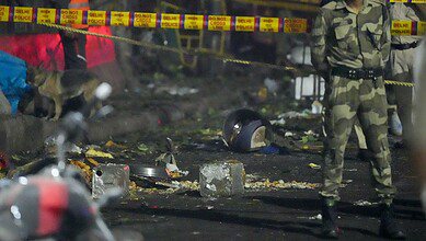 Tin containers and other items lie near the spot after a blast occurred in a parked car near Red Fort leaving multiple vehicles in flames in New Delhi on Monday. At least nine people were killed and 24 others suffered injuries in the incident. (PTI Photo/Salman Ali)