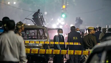 National Investigation Agency (NIA) team at the spot after a blast occurred in a parked car near Red Fort leaving multiple vehicles in flames on Monday. At least nine people were killed and 24 others suffered injuries in the incident. (PTI Photo/Salman Ali)