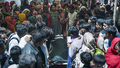 Family members and relatives of the e-rickshaw driver Jumman, who was killed in the blast near Red Fort, mourn after his mortal remains were brought to his residence in New Delhi on Tuesday. (PTI Photo/Karma Bhutia)