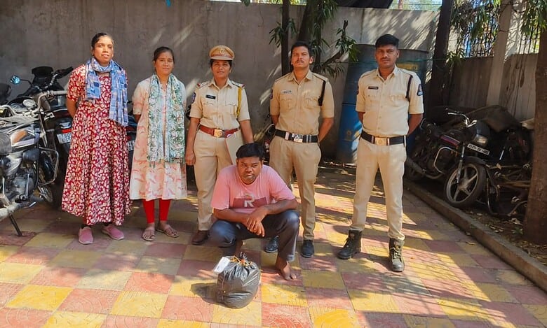 Telangana excise officials with the man held ganja peddling in Dhoolpet