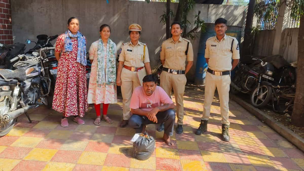 Telangana excise officials with the man held ganja peddling in Dhoolpet