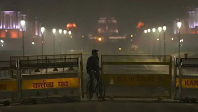 A Delhi police official inspects the blast site