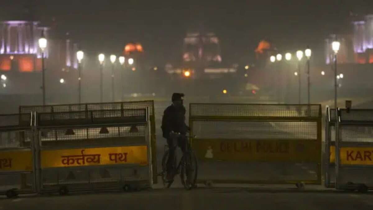 A Delhi police official inspects the blast site