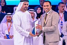 Indian expat Anas Kadiyarakam receives the labour award from Sheik Mansour bin Zayed