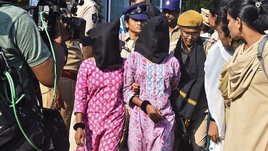 Vijayawada Police personnel with arrested Maoists in a coordinated intelligence-led operation in Andhra Pradesh. State Police arrested 50 CPI (Maoist) cadres across five districts. The crackdown coincided with an encounter at Maredumilli on Wednesday. (PTI Photo)