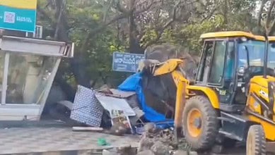 A make shift shop being demolished in Aramghar
