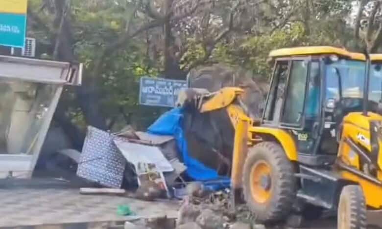 A make shift shop being demolished in Aramghar