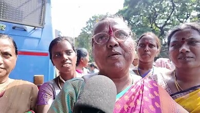 A Midday meal workers addresses the media during the protest