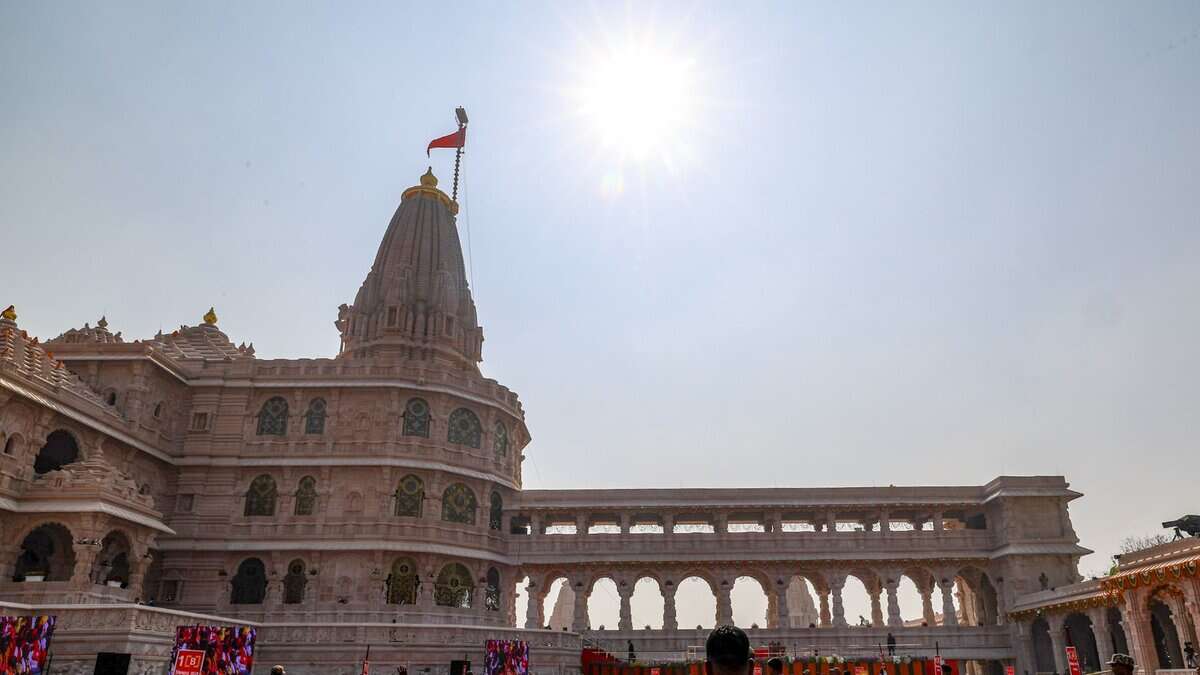 In this screenshot from a video posted on Nov. 25, 2025, A saffron flag being ceremonially hoisted by Prime Minister Narendra Modi, unseen, atop the Ram temple during a ceremony, in Ayodhya, Uttar Pradesh. (@NarendraModi/YT via PTI Photo)