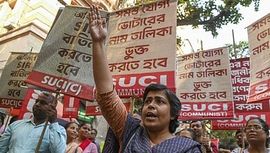 Members of Socialist Unity Centre of India (SUCI) protest against the alleged death of a Booth Level Officer in Kolkata