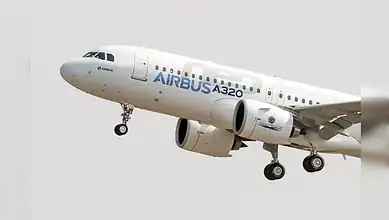 Airbus A320 approaching for landing with landing gear extended.