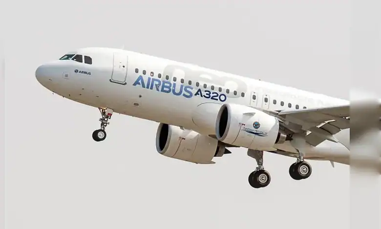 Airbus A320 approaching for landing with landing gear extended.