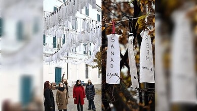 Left: Rows of white fabric strips bearing the handwritten names and ages of Palestinian children hang across a courtyard in Brescia, Italy, as several women look up at the installation. Right: Close-up of two white cloth ribbons tied to a branch, showing children’s names “SANAD” and “MEER” with their ages written below.
