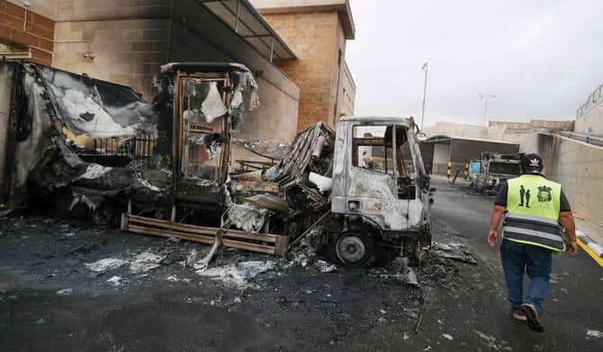 A Palestinian man inspects a burned truck after a settler attack in Beit Lid village, east of Tulkarm, in the occupied West Bank.