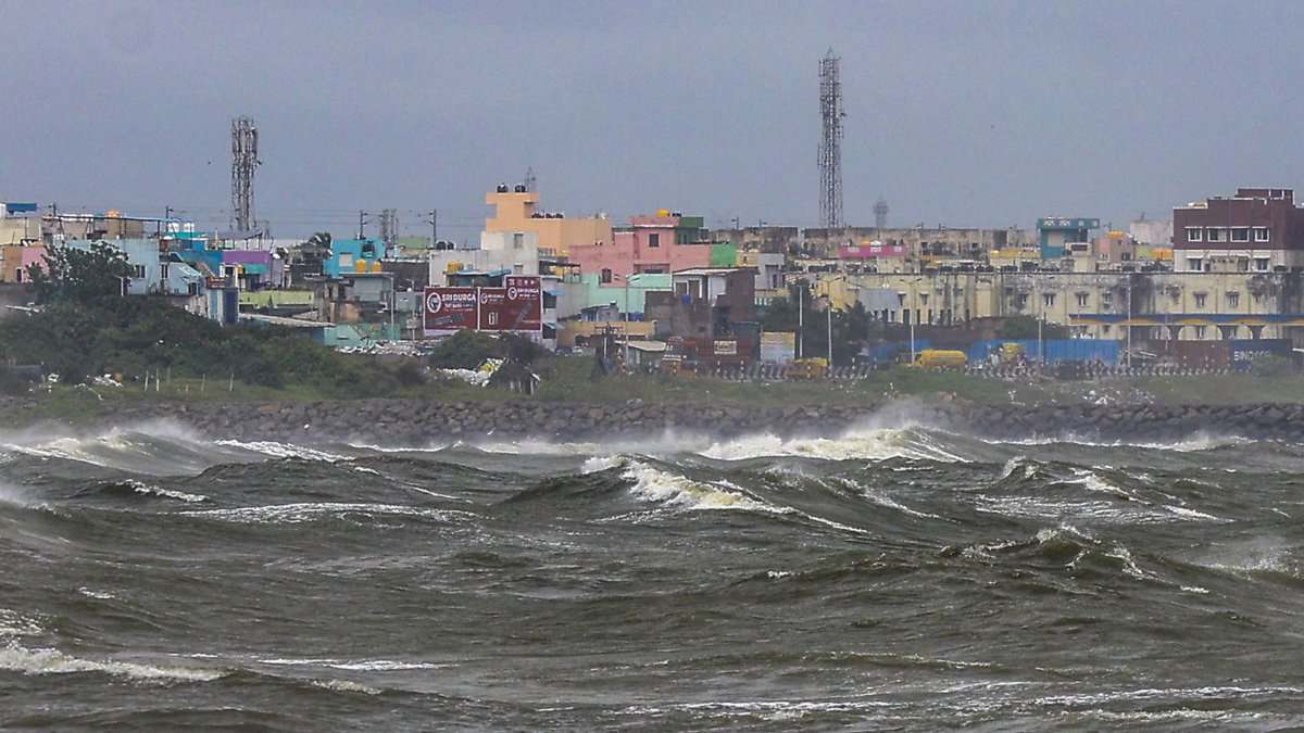 High waves lash the Kasimedu shoreline amid rough sea conditions in the wake of the Cyclone Ditwah in Chennai on Sunday. (PTI Photo)