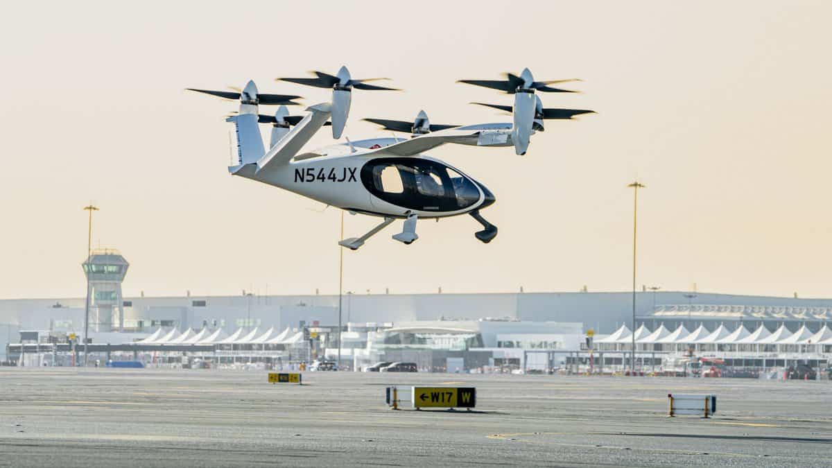 An electric vertical take-off and landing (eVTOL) air taxi operates during a test flight at Al Maktoum International Airport in Dubai.
