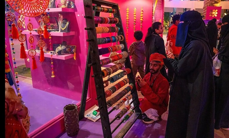 Visitors explore a colourful Indian bangle stall at the ‘Mini India’ bazaar during India Week at Riyadh Season.