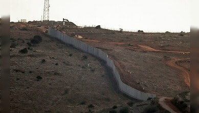 A concrete border wall built by the Israeli army along a hillside near the Lebanon–Israel boundary.