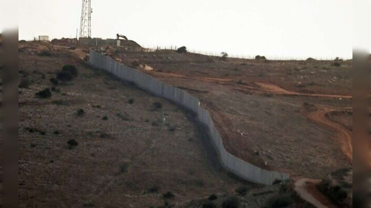 A concrete border wall built by the Israeli army along a hillside near the Lebanon–Israel boundary.