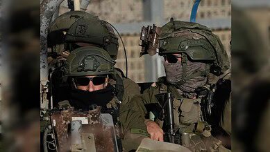 Israeli soldiers in full gear crossing into the buffer zone near Syria.