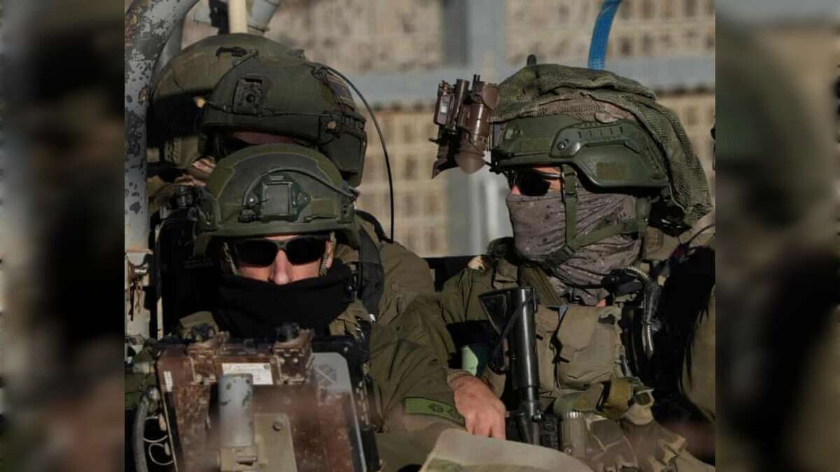Israeli soldiers in full gear crossing into the buffer zone near Syria.
