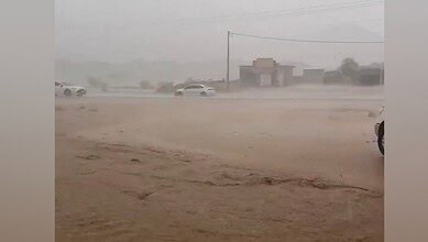 Cars drive through heavy rain and flooding in the Makkah region, Saudi Arabia.
