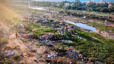 Garbage lined up near the Chaderghat bridge after heavy rainfall