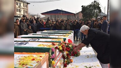Jammu and Kashmir Lieutenant Governor Manoj Sinha lays a wreath on the mortal remains of the nine persons killed in the accidental blast at Nowgam police station, which also left 32 injured, at the Police Control Room, in Srinagar