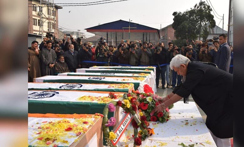 Jammu and Kashmir Lieutenant Governor Manoj Sinha lays a wreath on the mortal remains of the nine persons killed in the accidental blast at Nowgam police station, which also left 32 injured, at the Police Control Room, in Srinagar