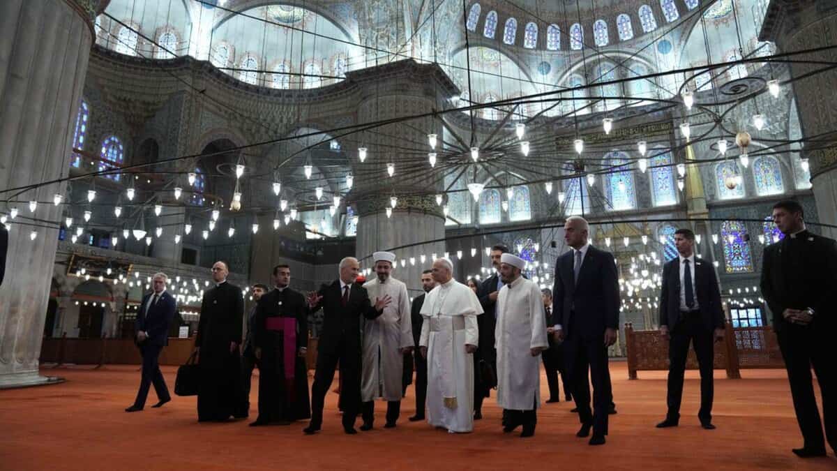 Pope Leo XIV tours the interior of Istanbul’s Sultan Ahmed Mosque with religious officials.