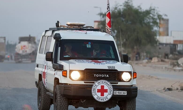 A Red Cross vehicle drives along a road in Gaza during a body handover operation between Israel and Gaza authorities.