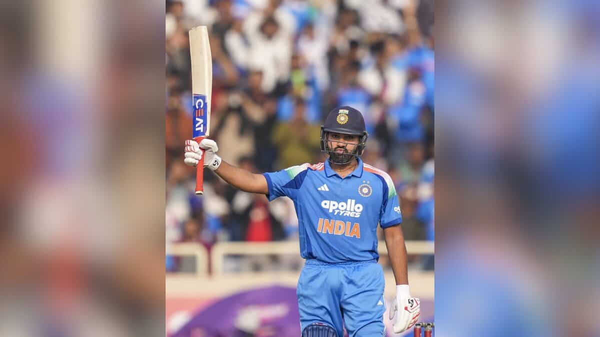 India's Rohit Sharma celebrates his half century during the first ODI cricket match of a series between India and South Africa at JSCA International Stadium Complex in Ranchi on Sunday. (PTI Photo/Kamal Kishore)