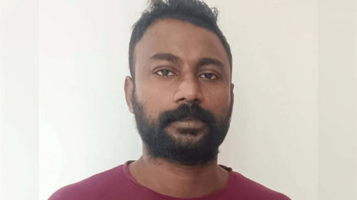 Portrait of Shameem KK, the accused, standing against a plain background.