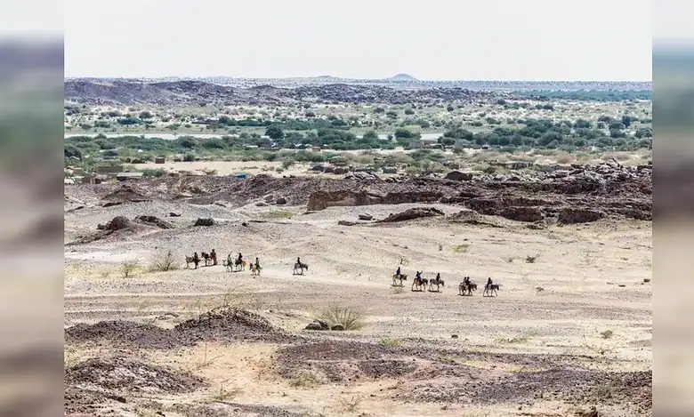 Sudanese refugees ride donkeys on the road between the lake and Oure Cassoni camp in Chad on November 14.
