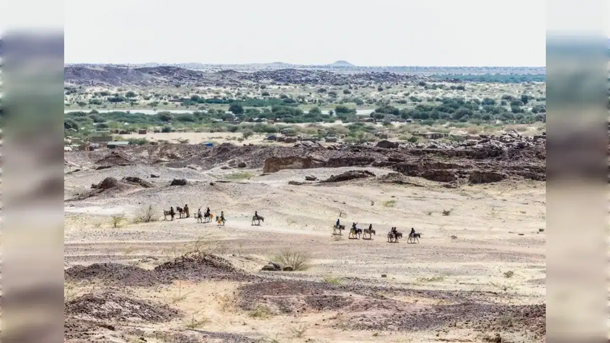 Sudanese refugees ride donkeys on the road between the lake and Oure Cassoni camp in Chad on November 14.