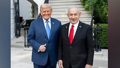 US President Donald Trump and Israeli Prime Minister Benjamin Netanyahu stand together outside a building, smiling for a photograph.