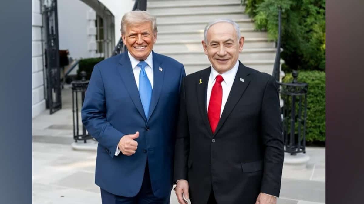 US President Donald Trump and Israeli Prime Minister Benjamin Netanyahu stand together outside a building, smiling for a photograph.