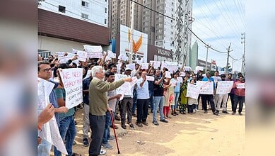 Image shows homeowners protesting at Vasavi Urban project in Bachupally