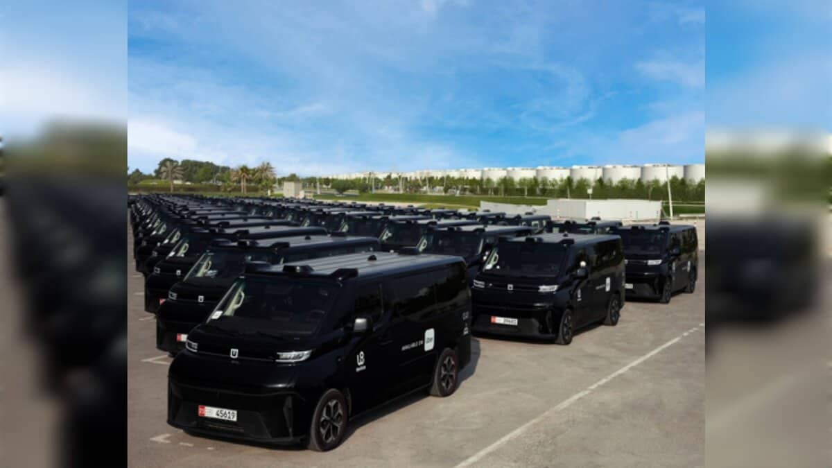 A fleet of WeRide driverless Robotaxi vehicles lined up in Abu Dhabi.