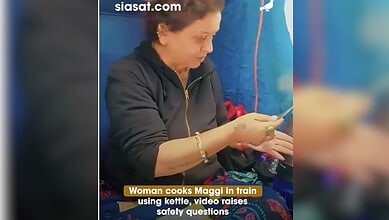 woman cooks maggin in train using kettle