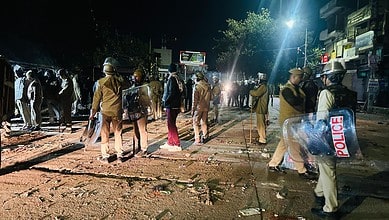 Four police officers were hurt in a stone-throwing incident