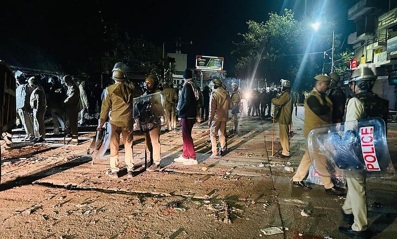 Four police officers were hurt in a stone-throwing incident
